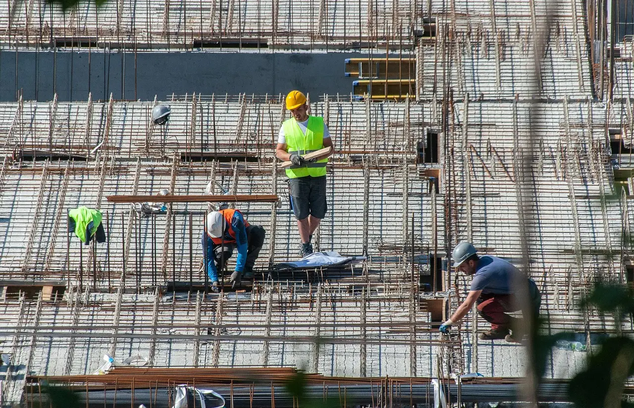 Construction crew working together on a reinforced concrete structure